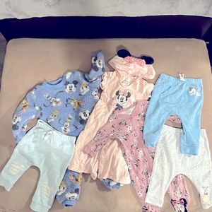 Walt Disney gently used3 bottoms 2 onesies and 1 top w matching bottoms